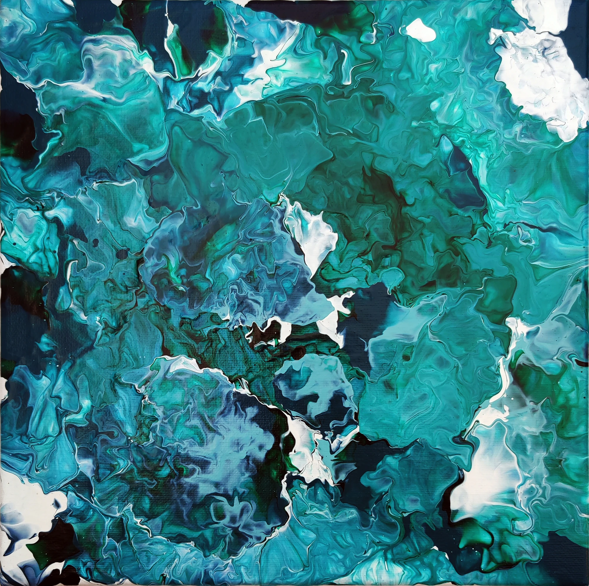 Open white passages separate islands of turquoise and deep green.